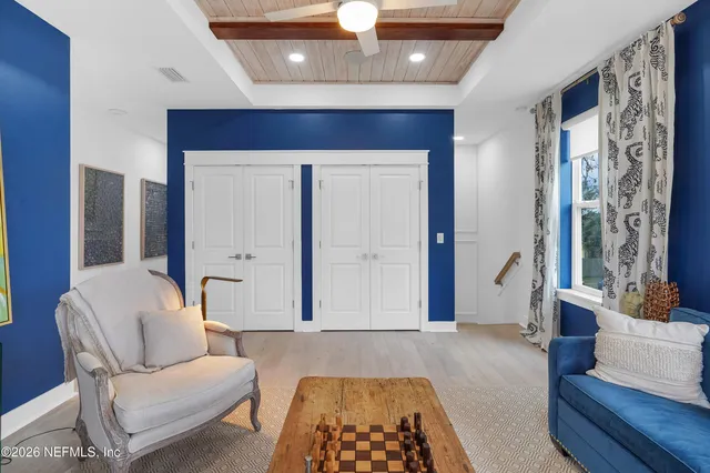 a view of a balcony with floor to ceiling windows with wooden floor