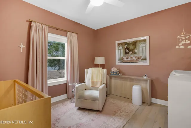 a room with painting and a table