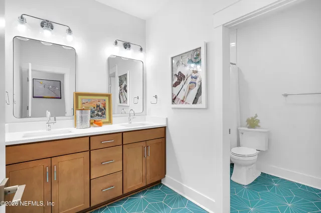 a view of a patio with table and chairs with wooden floor and fence
