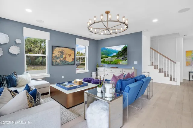 a living room with furniture and a table