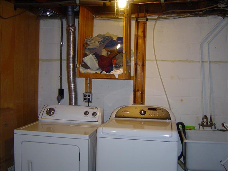 5055 Dutch Ridge Road Beaver, PA 15009 - Photo 14 of 20 Laundry chute ends at the washer and dryer in the laundry room.