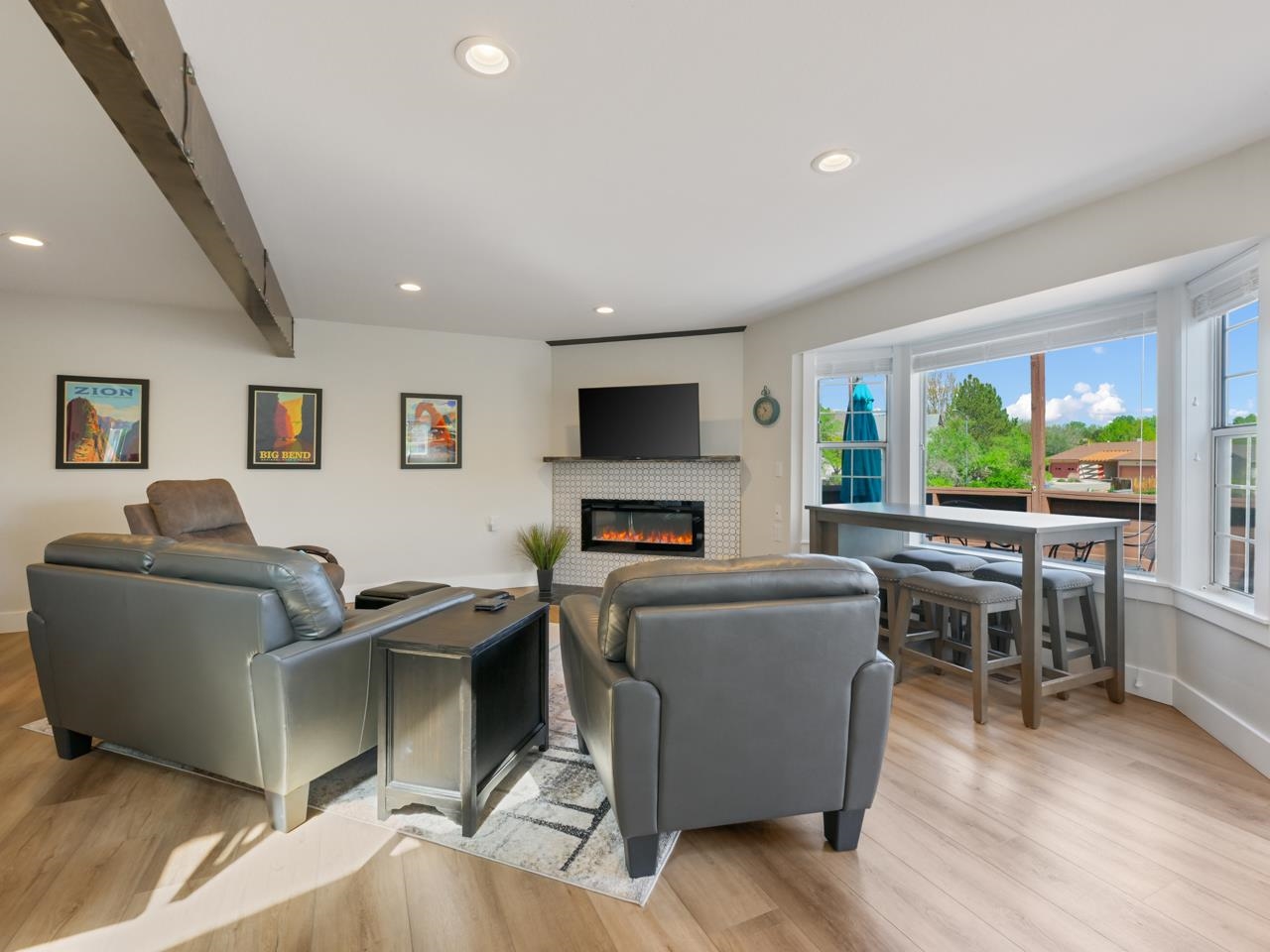 383 Explorer Court, Unit B Grand Junction, CO 81507 - Photo 10 of 40 a living room with furniture and a flat screen tv