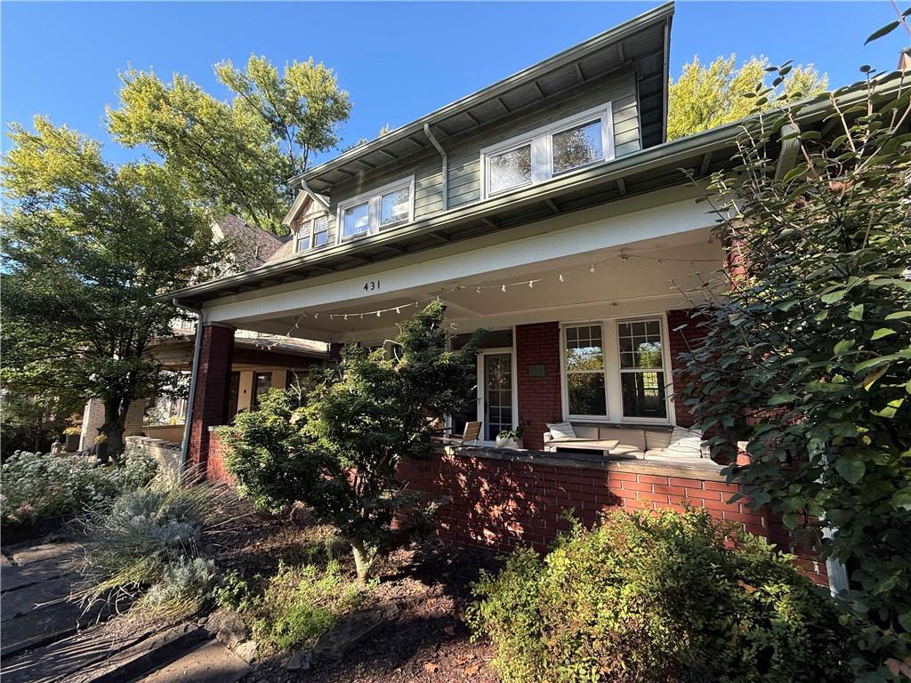 a view of a building with sitting area