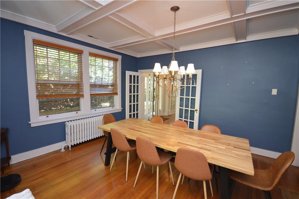 431 Locust Street Pittsburgh, PA 15218 - Photo 12 of 47 a view of a dining room with furniture wooden floor and chandelier