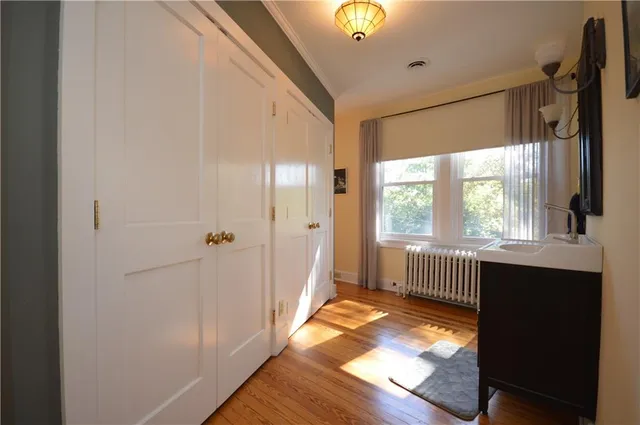 a view of a room with a fireplace and window