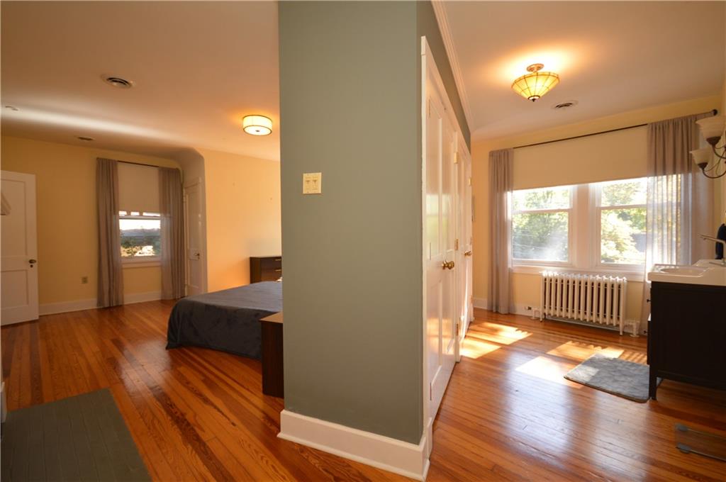 431 Locust Street Pittsburgh, PA 15218 - Photo 27 of 47 a view of an empty room with wooden floor and a window