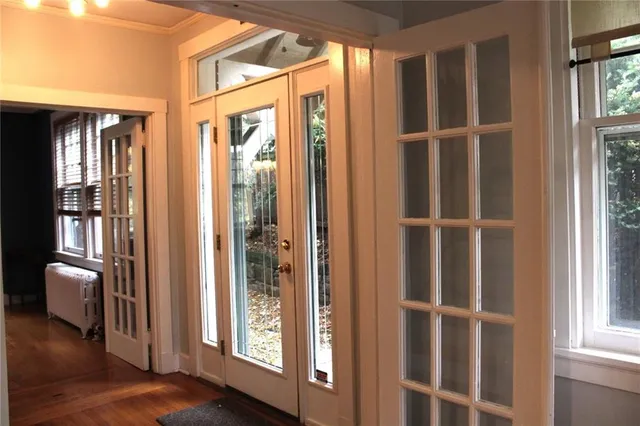 a view of front door with wooden floor