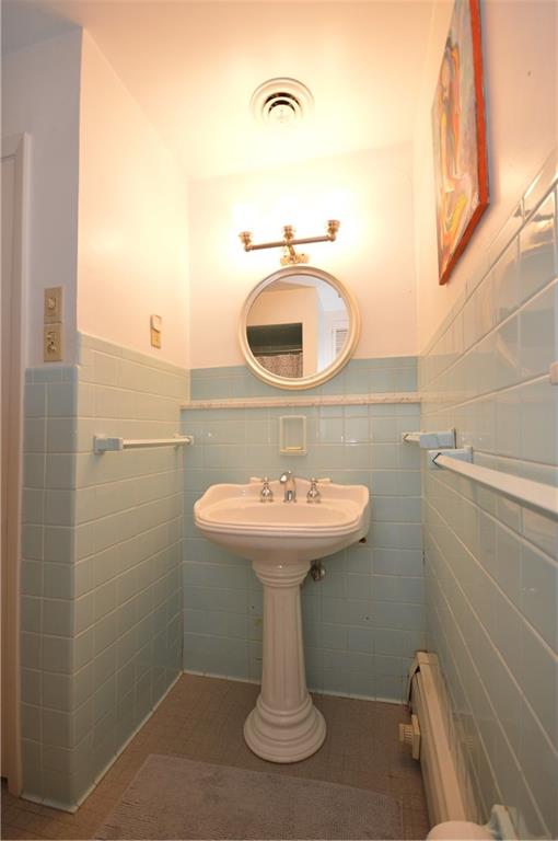 431 Locust Street Pittsburgh, PA 15218 - Photo 31 of 47 a bathroom with a sink and a mirror