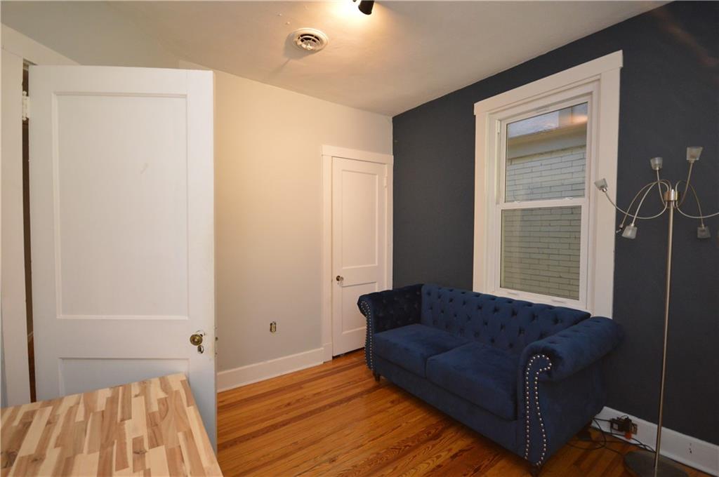 431 Locust Street Pittsburgh, PA 15218 - Photo 35 of 47 a living room with furniture and a wooden floor