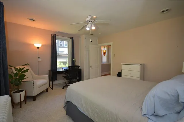 a bedroom with a bed and window