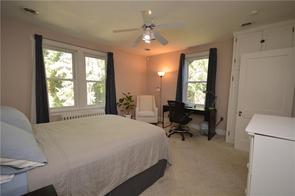 431 Locust Street Pittsburgh, PA 15218 - Photo 38 of 47 a bed room with a bed mirror and a window