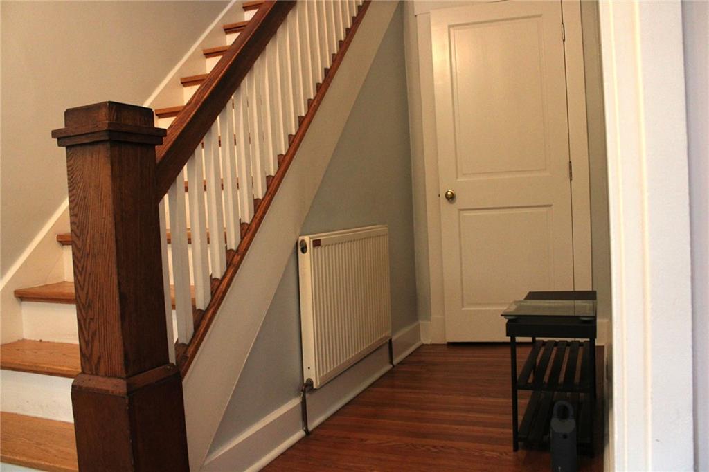 431 Locust Street Pittsburgh, PA 15218 - Photo 5 of 47 a view of a hallway with wooden floor and staircase