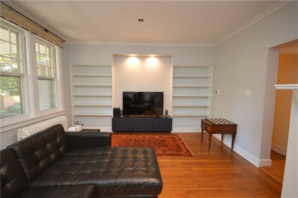 431 Locust Street Pittsburgh, PA 15218 - Photo 6 of 47 a living room with furniture and a flat screen tv