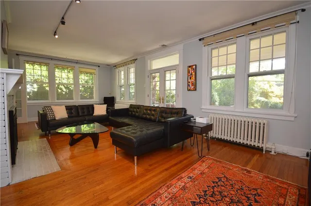 a living room with furniture and a window