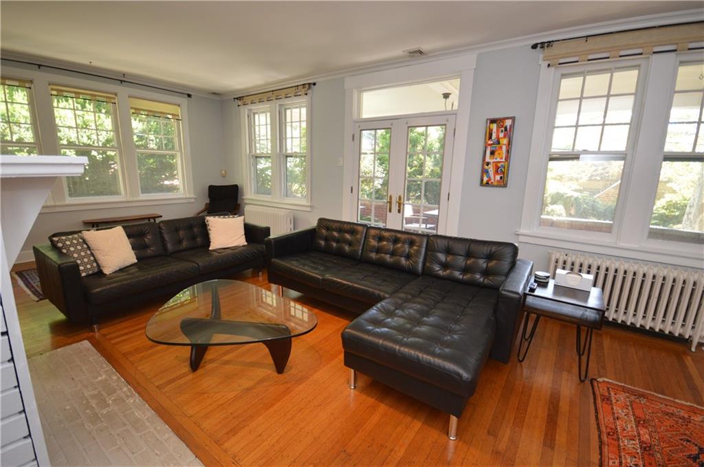 431 Locust Street Pittsburgh, PA 15218 - Photo 8 of 47 a living room with furniture and a potted plant with wooden floor