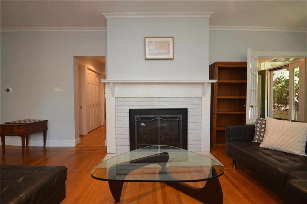 431 Locust Street Pittsburgh, PA 15218 - Photo 10 of 47 a living room with furniture and a fireplace