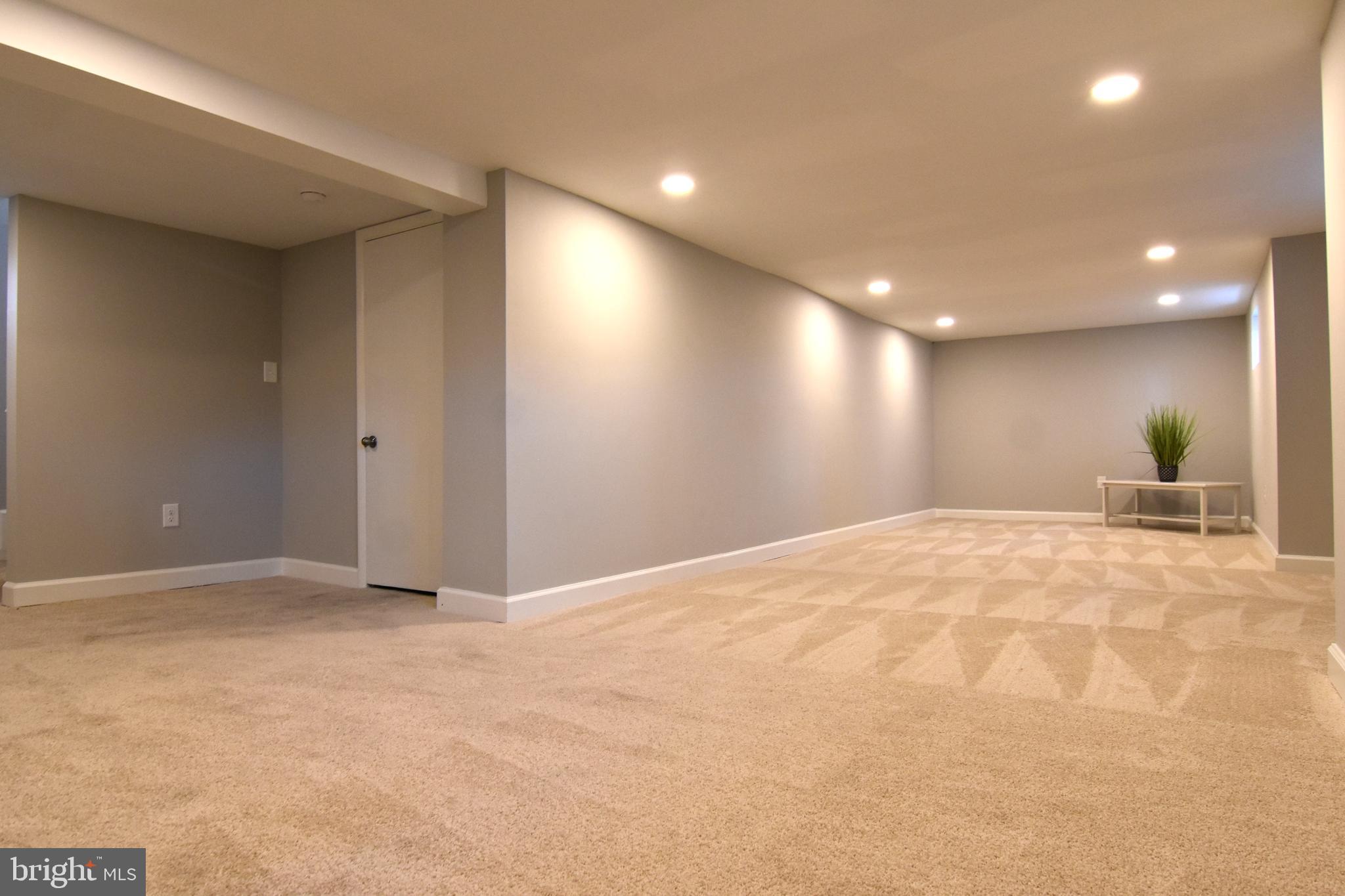 8450 Church Road Pasadena, MD 21122 - Photo 21 of 29 lower level family room