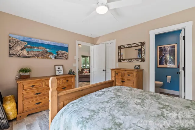 a bedroom with a bed and a dresser