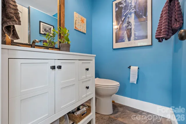 a bathroom with a toilet and a sink