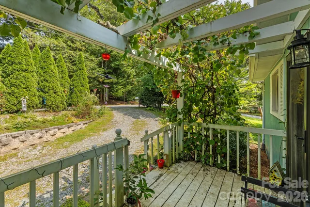 a view of a balcony with wooden floor