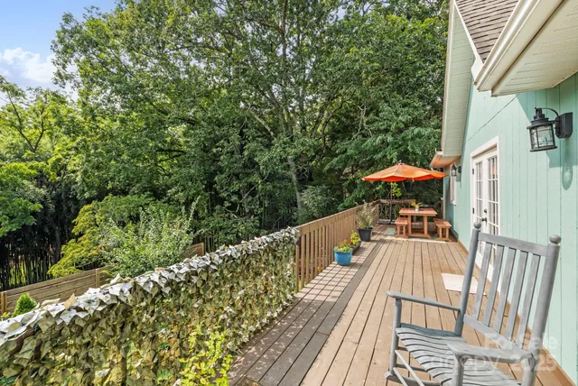 a view of balcony with furniture