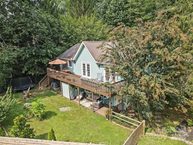 a view of a house with roof deck front of house