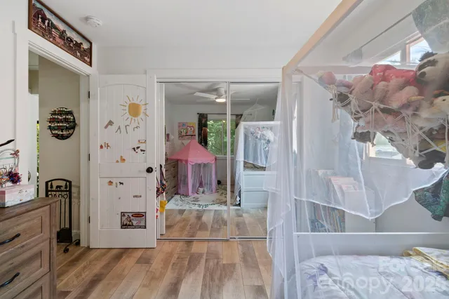 a view of front door and bedroom