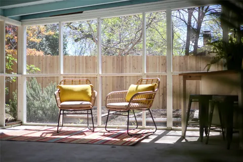 a building outdoor space with patio furniture