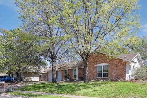 front view of a house with a trees