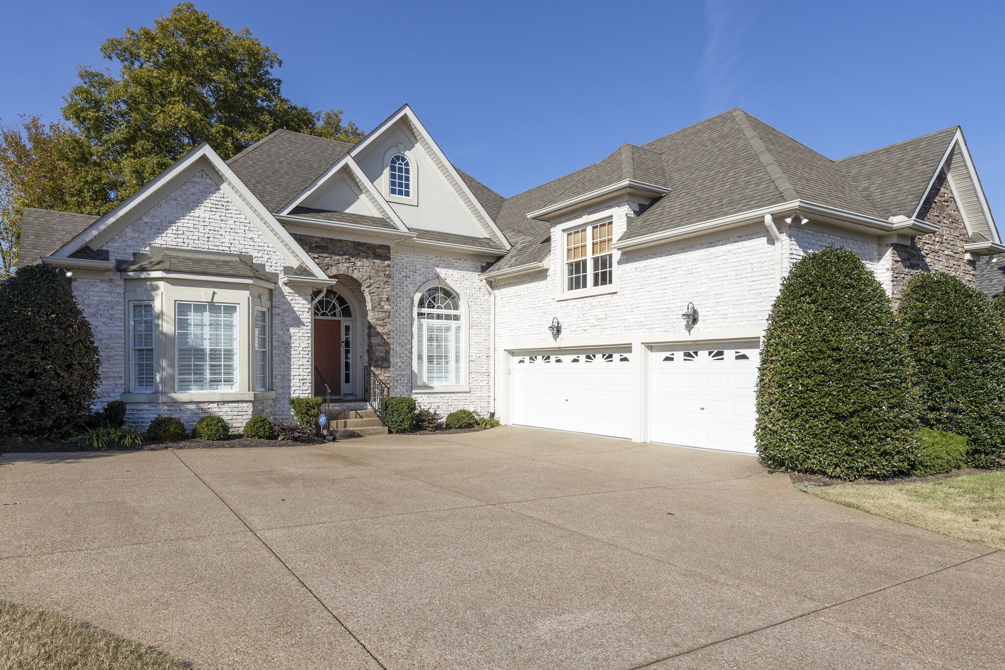 a view of a white house with a outdoor space