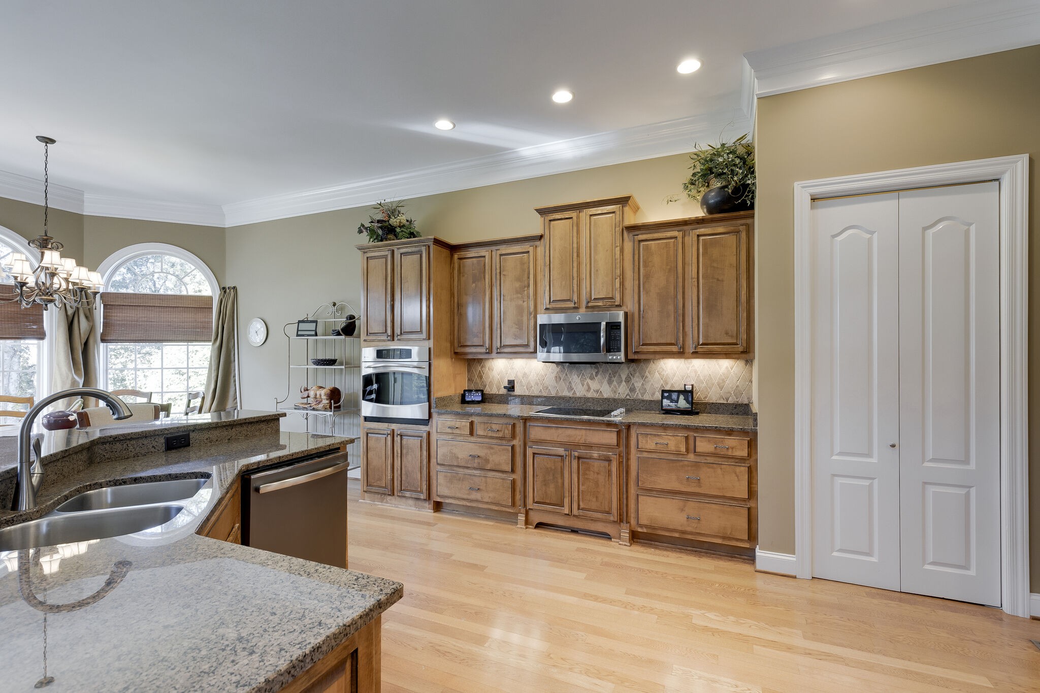 69 Blue Ridge Trace Hendersonville, TN 37075 - Photo 14 of 50 a kitchen with stainless steel appliances granite countertop a stove a sink a refrigerator and a granite counter tops