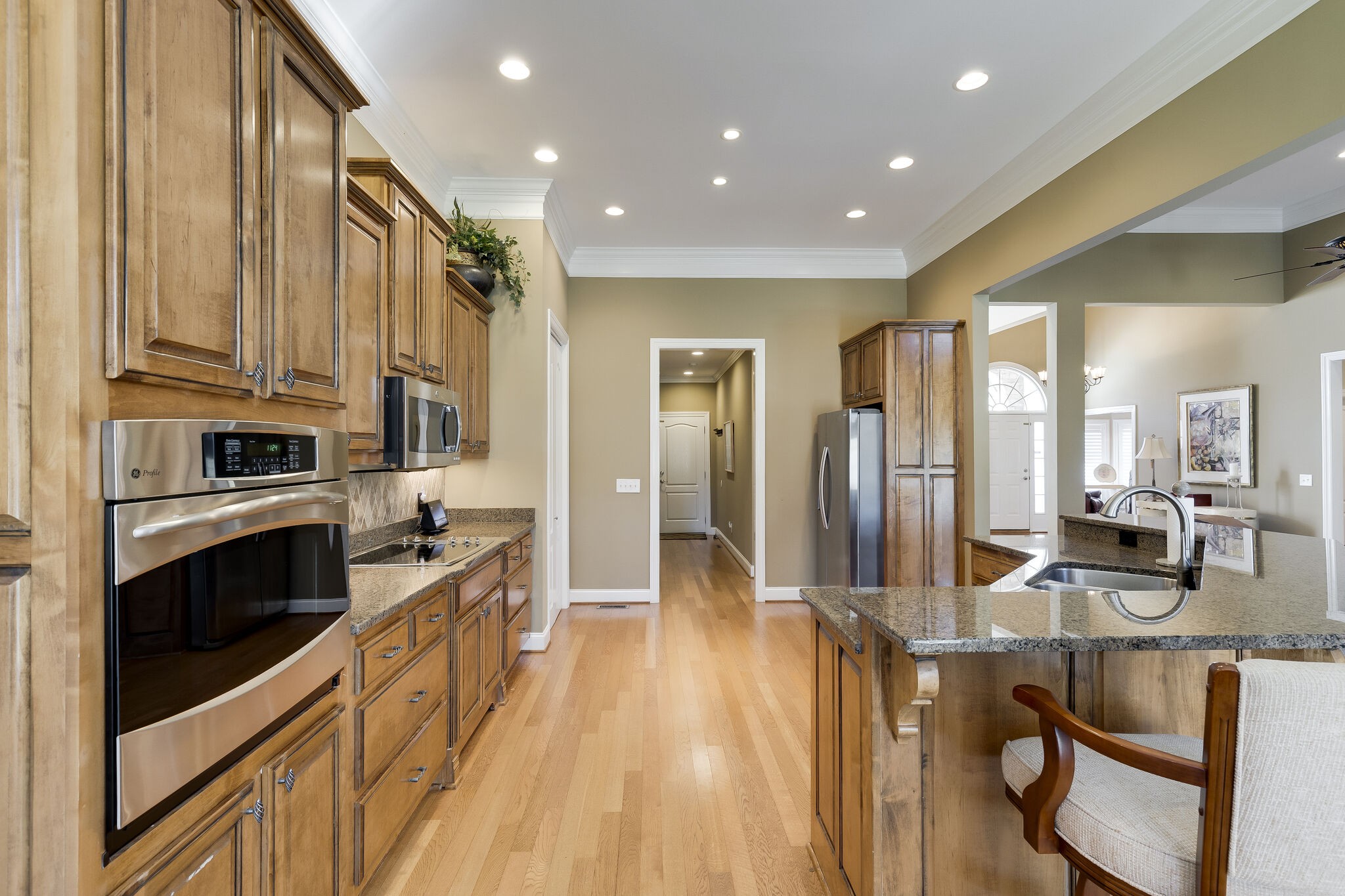 69 Blue Ridge Trace Hendersonville, TN 37075 - Photo 15 of 50 a kitchen with stainless steel appliances a refrigerator a stove top oven a sink dishwasher and cabinets with wooden floor