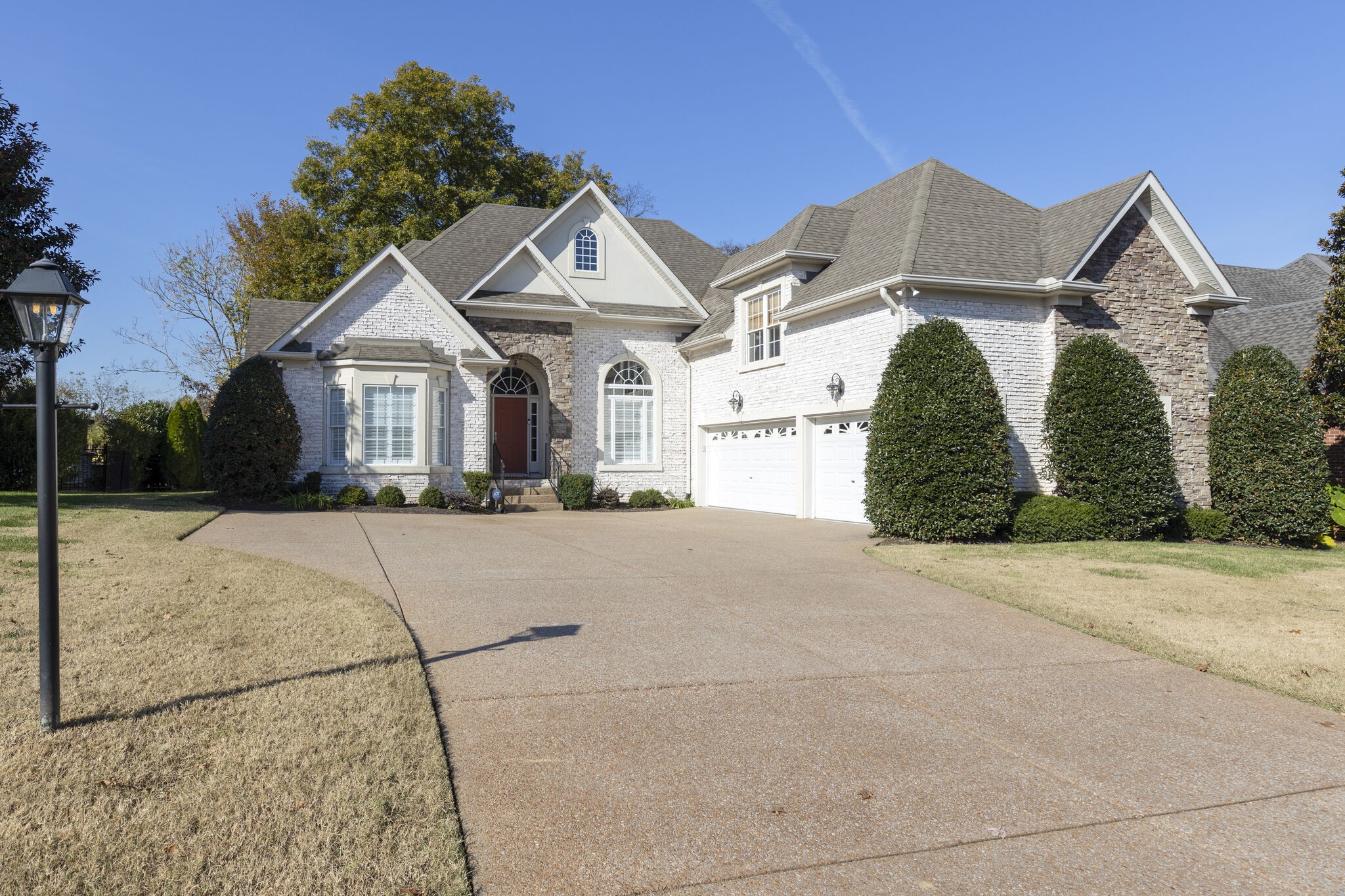 69 Blue Ridge Trace Hendersonville, TN 37075 - Photo 3 of 50 a front view of a house with a yard and garage
