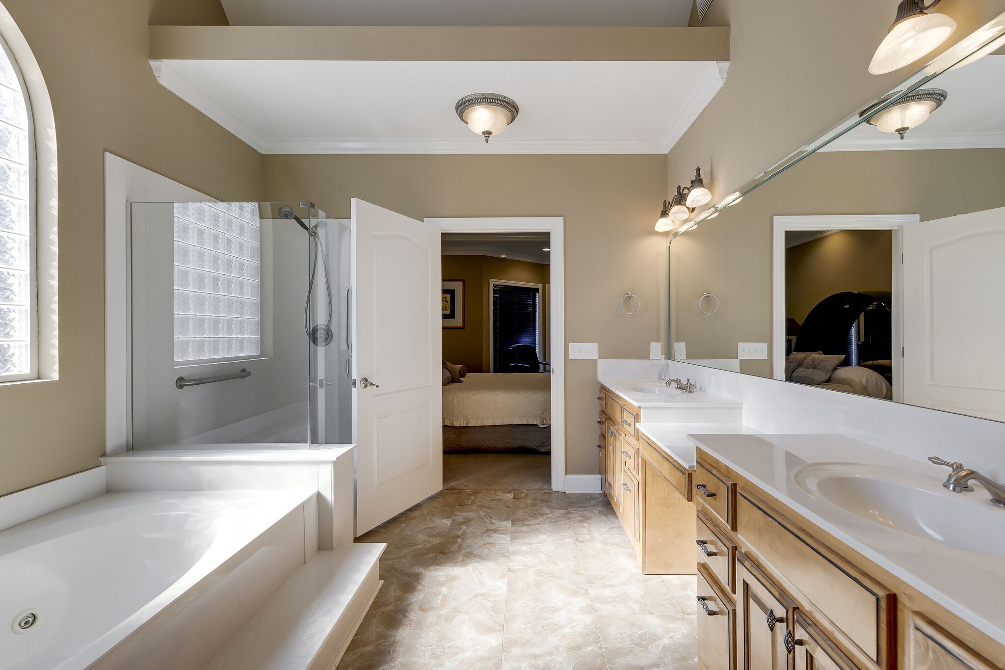 69 Blue Ridge Trace Hendersonville, TN 37075 - Photo 26 of 50 a large bathroom with a double vanity sink a large mirror and a bathtub