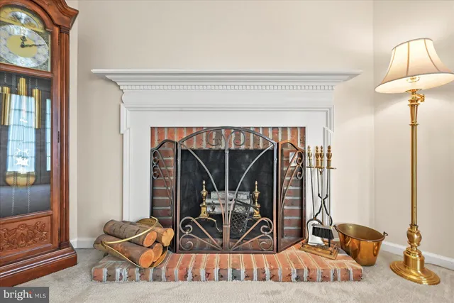 a living room with furniture a rug and a large window