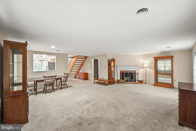 a view of a livingroom with furniture and a window