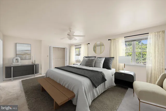 a bedroom with a large bed and a couch