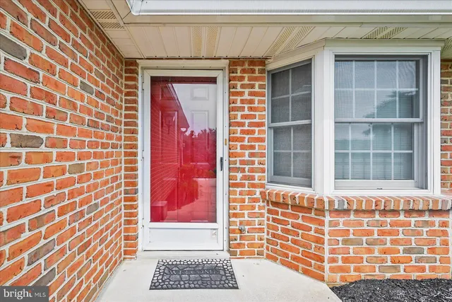 a view of a door and a window
