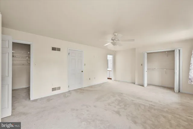 an empty room with a bathroom