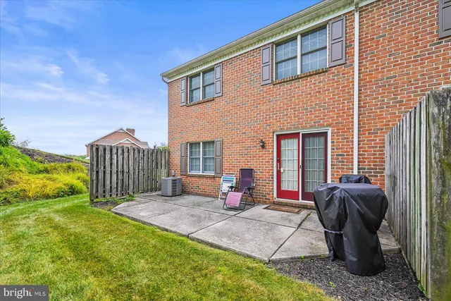 a view of a patio with a table and chairs
