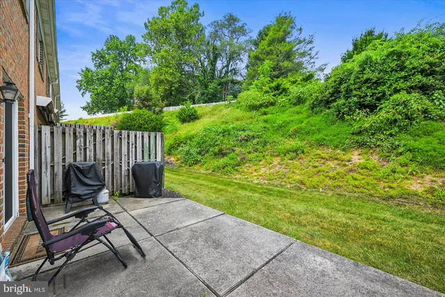 a bench sitting in the middle of a yard
