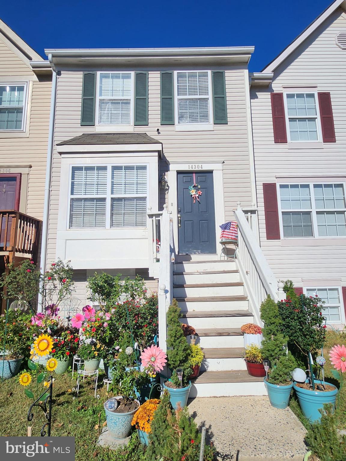 14304 Newbern Loop Gainesville, VA 20155 - Photo 2 of 4 a view of a house with flower pots