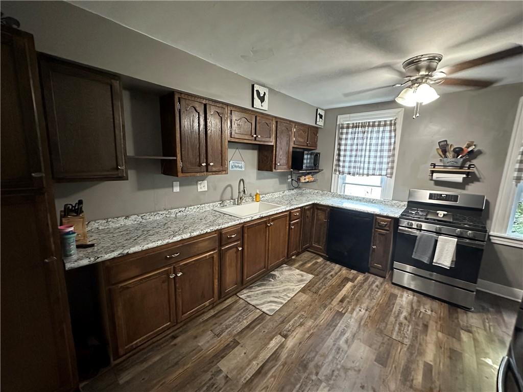 173 Portman Road Butler, PA 16002 - Photo 13 of 19 a kitchen with stainless steel appliances kitchen island granite countertop a sink stove and cabinets