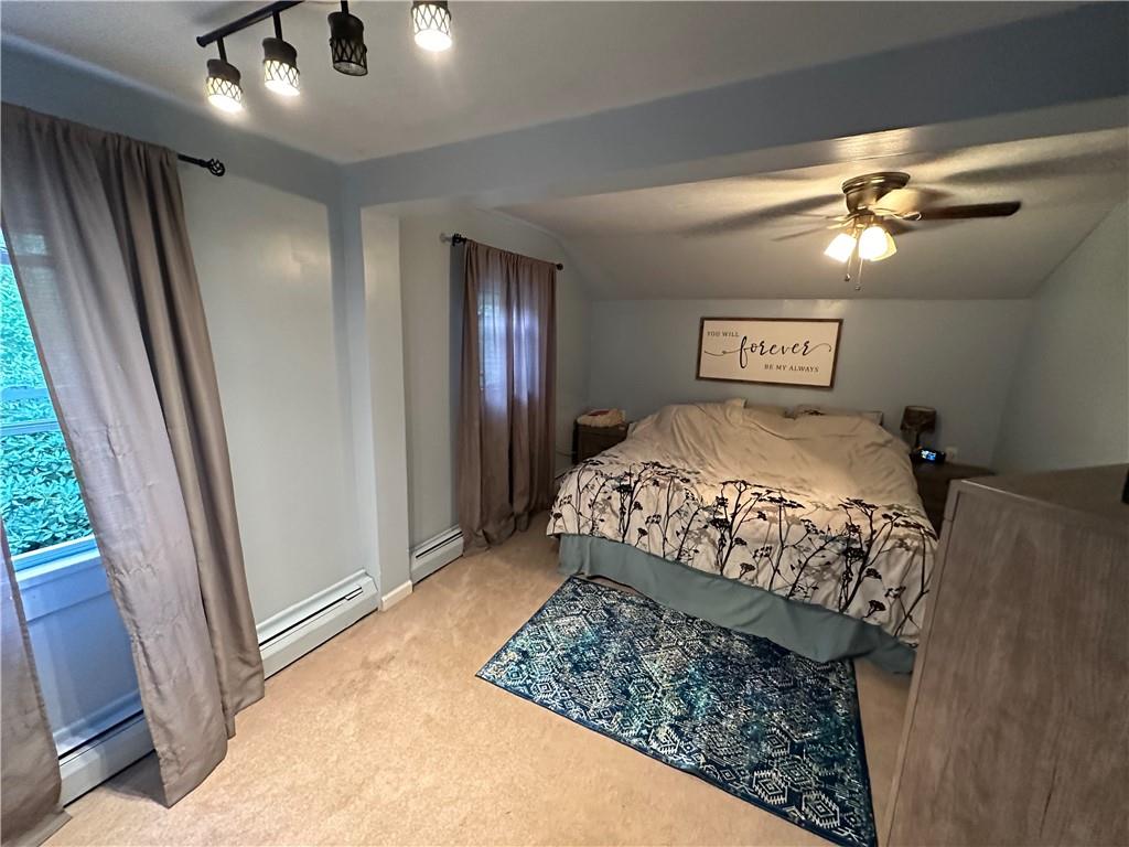 173 Portman Road Butler, PA 16002 - Photo 17 of 19 a bedroom with a bed and a chandelier