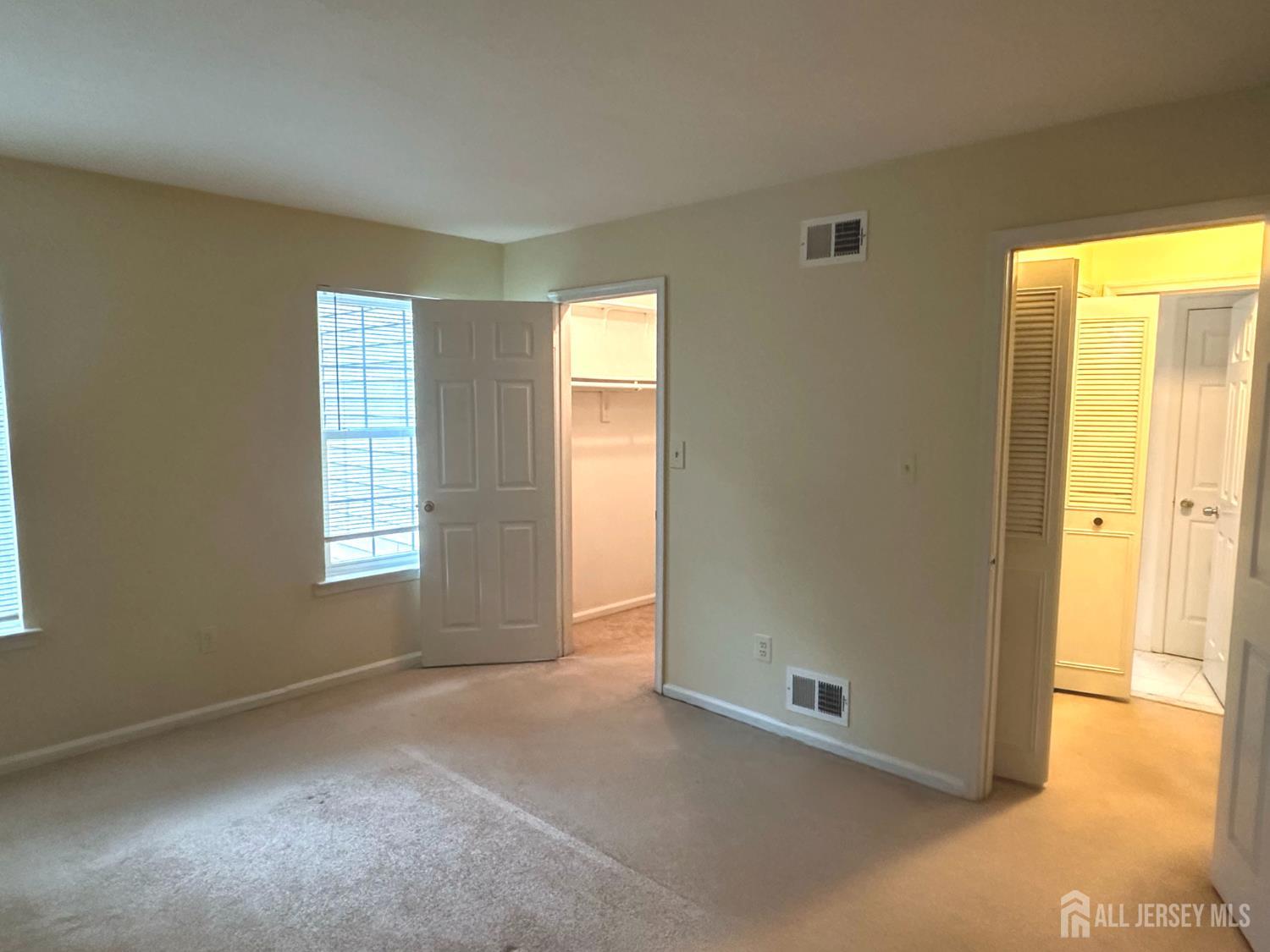 603 Woodbridge Commons Way Iselin, NJ 08830 - Photo 13 of 14 a view of an empty room with a window