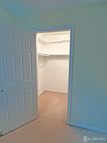 a view of an empty room and a window