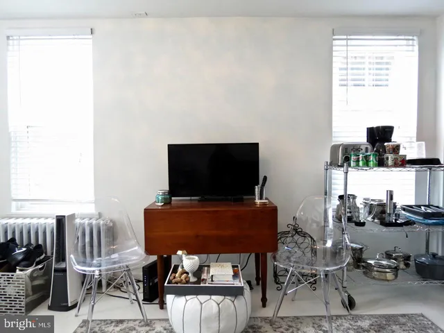 a view of a livingroom with furniture and a flat screen tv