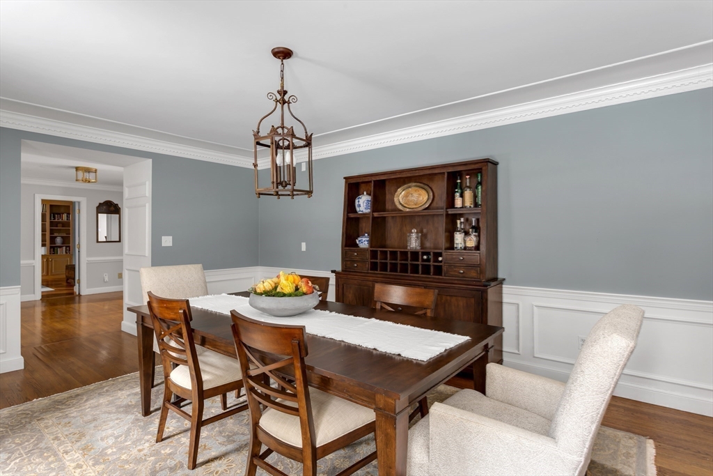 138 Pine Street Dover, MA 02030 - Photo 12 of 38 a dining room with furniture a rug and a chandelier