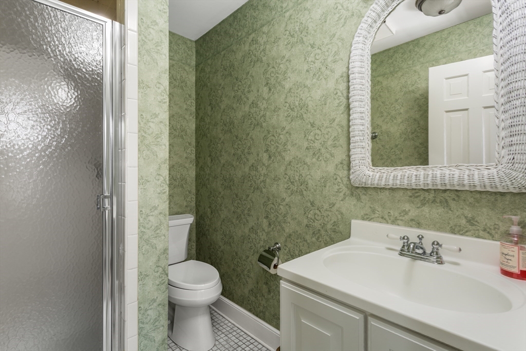 138 Pine Street Dover, MA 02030 - Photo 19 of 38 a bathroom with a sink a toilet and a mirror