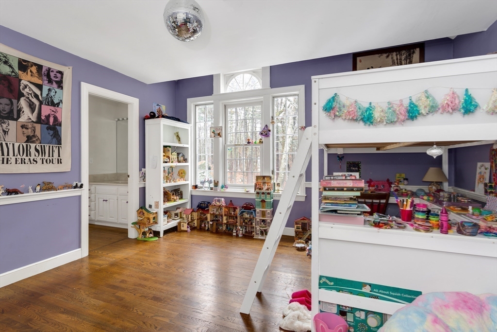 138 Pine Street Dover, MA 02030 - Photo 25 of 38 a bedroom with furniture and a flat screen tv
